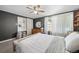 Cozy bedroom featuring built-in shelving and ample natural light at 2823 Jasmine St, Denver, CO 80207