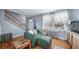 Cozy living room with hardwood floors, a comfortable couch and a staircase at 2823 Jasmine St, Denver, CO 80207