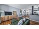 Comfortable living area with hardwood floors, a stylish couch, and bright lighting at 2823 Jasmine St, Denver, CO 80207