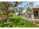 Lush backyard with an outdoor patio, a grill, and plenty of green space, perfect for outdoor entertaining at 8216 S Tempe Ct, Aurora, CO 80016