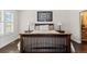Beautiful bedroom with a decorative headboard, wood floors, and light-filled windows at 8216 S Tempe Ct, Aurora, CO 80016