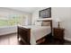 Bright bedroom with dark wood floors, a large window, and plenty of natural light at 8216 S Tempe Ct, Aurora, CO 80016