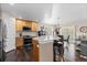Modern kitchen featuring granite countertops, stainless steel appliances, and an open layout at 8216 S Tempe Ct, Aurora, CO 80016