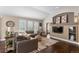Cozy living area with a vaulted ceiling, stylish furnishings, and plenty of natural light at 8216 S Tempe Ct, Aurora, CO 80016