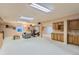 Finished basement with space for exercise equipment, a seating area, and ample cabinetry at 884 W 124Th Dr, Denver, CO 80234