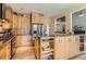 Spacious kitchen with custom wood cabinets, granite countertops, and stainless steel appliances at 884 W 124Th Dr, Denver, CO 80234