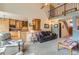 Cozy living room featuring an open layout, plush carpeting, and a staircase at 884 W 124Th Dr, Denver, CO 80234