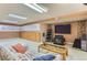 Spacious living room with custom cabinets, carpeted floors, and large screen television at 884 W 124Th Dr, Denver, CO 80234