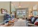 Spacious living room featuring a fireplace, plush carpeting, and natural light at 884 W 124Th Dr, Denver, CO 80234