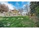 Expansive backyard with mature trees, a storage shed, and plenty of room for recreation at 1244 S Wright St, Lakewood, CO 80228