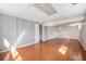 Well-lit finished basement with hardwood floors, perfect for entertaining or relaxing at 1244 S Wright St, Lakewood, CO 80228