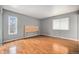 Sunlit bedroom with hardwood floors and neutral paint, creating a serene and inviting atmosphere at 1244 S Wright St, Lakewood, CO 80228