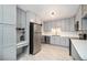 Well-appointed kitchen featuring sleek countertops, stainless steel appliances, and ample cabinet space at 1244 S Wright St, Lakewood, CO 80228
