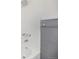 Close-up of renovated shower with updated fixtures and convenient towel bar at 1244 S Wright St, Lakewood, CO 80228