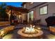 Relaxing backyard with a fire pit, patio and pergola covered seating offering an outdoor retreat at 13822 Worthington Pl, Parker, CO 80134