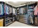 Spacious walk-in closet with built-in shelving and storage solutions at 13822 Worthington Pl, Parker, CO 80134