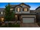 Charming two-story home with a well-manicured lawn and inviting front porch at 13822 Worthington Pl, Parker, CO 80134