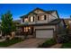 Charming two-story home with a well-manicured lawn and inviting front porch at 13822 Worthington Pl, Parker, CO 80134