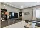Inviting living room featuring custom built-ins, modern decor, and plush carpeting at 13822 Worthington Pl, Parker, CO 80134