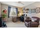 Cozy office space with a desk, ample storage, and a comfortable leather chair at 13822 Worthington Pl, Parker, CO 80134