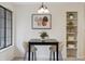 Eat in dining area with modern lighting fixture and built in shelving in neutral tones at 836 S Vance St # E, Lakewood, CO 80226