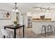 Bright kitchen and adjacent dining area featuring stainless steel appliances and countertop seating at 836 S Vance St # E, Lakewood, CO 80226