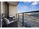 Relax on the balcony with comfortable outdoor seating and enjoy the views of the cityscape at 1735 Central St # 208, Denver, CO 80211