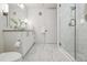 Modern bathroom with double vanity and marble floors at 1735 Central St # 208, Denver, CO 80211