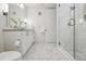 Contemporary bathroom featuring marble floors, a glass shower, and modern fixtures at 1735 Central St # 208, Denver, CO 80211