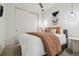 Stylish bedroom with modern lighting fixtures, sliding closet door, and chic decor at 1735 Central St # 208, Denver, CO 80211