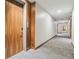 Hallway with modern wood doors, neutral walls, and updated lighting at 1735 Central St # 208, Denver, CO 80211