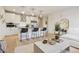 Kitchen and living room with stainless steel appliances, counter seating, and modern décor at 1735 Central St # 208, Denver, CO 80211