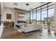 Inviting living room with a fireplace, large windows and hardwood floors, perfect for relaxation and entertaining at 1735 Central St # 208, Denver, CO 80211