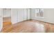 Bright, open bedroom with hardwood floors, a closet, and plenty of natural light at 9700 E Iliff Ave # G70, Denver, CO 80231