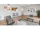 Cozy living room showcases bar stool seating, white walls, hardwood floors and view to kitchen at 9700 E Iliff Ave # G70, Denver, CO 80231