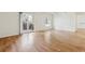 Open living room with hardwood floors, a sliding glass door, and a window at 9700 E Iliff Ave # G70, Denver, CO 80231
