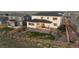 Aerial view of fenced backyard with small lawn area, patio, trampoline, and well-maintained landscaping at 14373 Shasta Daisy Pt, Parker, CO 80134
