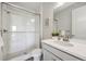 Bathroom with a glass-enclosed shower and modern vanity with a sleek design at 14373 Shasta Daisy Pt, Parker, CO 80134