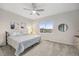 Cozy bedroom with comfortable bed, soft carpet, and a bright window providing natural light at 14373 Shasta Daisy Pt, Parker, CO 80134