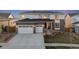 Beautiful two-story home with a two-car garage and modern design elements at 14373 Shasta Daisy Pt, Parker, CO 80134