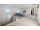 Relaxing loft area with comfortable seating and natural light, perfect for unwinding and entertaining at 14373 Shasta Daisy Pt, Parker, CO 80134