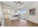 Bright home office featuring a large window and view to the kitchen, ideal for remote work at 14373 Shasta Daisy Pt, Parker, CO 80134