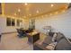 Inviting outdoor patio area complete with comfortable seating, a grill, and a cozy fire pit at 14373 Shasta Daisy Pt, Parker, CO 80134