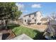 Backyard features mature trees, green grass, and a deck for outdoor enjoyment at 1534 Stanley Dr, Erie, CO 80516