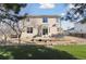 Backyard features a deck, lush green grass, and privacy at 1534 Stanley Dr, Erie, CO 80516