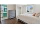 Bedroom features modern dresser, closet, and a large window for natural light at 1534 Stanley Dr, Erie, CO 80516