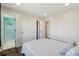Light and airy bedroom with a connected bathroom and walk-in closet, hardwood floors, and modern doors at 1534 Stanley Dr, Erie, CO 80516