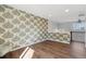 Bonus room features unique wall paper and hardwood floors at 1534 Stanley Dr, Erie, CO 80516