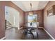 Inviting dining room with a wooden table, bench seating, and stylish light fixture at 1534 Stanley Dr, Erie, CO 80516
