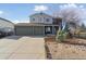 Charming two-story home featuring a spacious three-car garage and welcoming front porch with ample curb appeal at 1534 Stanley Dr, Erie, CO 80516